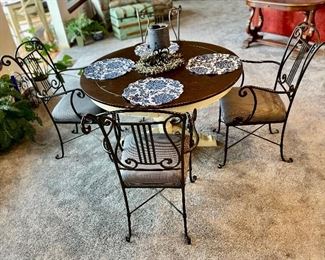 5 pc dining set with iron chairs, pedestal wood table.