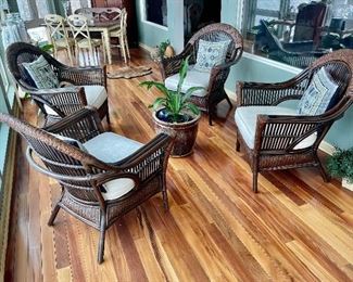 Set of 4 rattan chairs with pads.