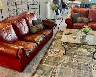Lazyboy red leather and studded rolled arm sofa and love seat.