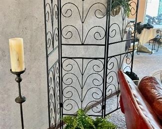 Metal scrolling room divider. 