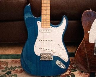 Fender Stratocaster, custom limited series. Blue grain- white pick guard, Abilone inlays, Beautiful neck with custom locking tuners.