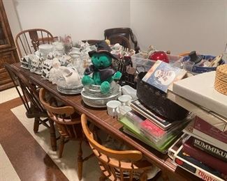 . . . lots of treasures on top of this large dining room table (with six chairs)