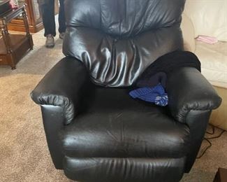 . . . a black leather recliner