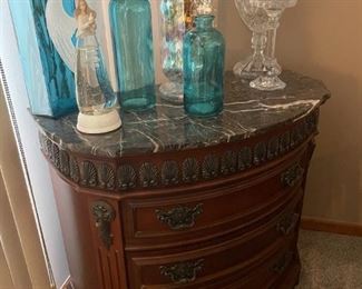 . . . love this cute break front with marble top and crystal accents/angel