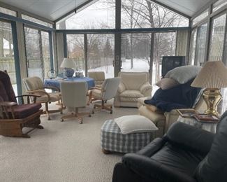 . . . a wonderful selection of white leather furniture, dining table and chairs, glider rocker, brass lamp, ottoman, and more!