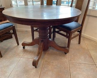 Old wooden oak round dining room table with 6 chairs Table 30 inches high 41.5 inches in diameter chair seating height 20.5 inches chair with 17 inches