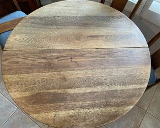Old wooden oak round dining room table with 6 chairs Table 30 inches high 41.5 inches in diameter chair seating height 20.5 inches chair with 17 inches