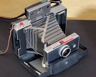 Polaroid Automatic 100 Land Camera	2.5x8x5in	HxWxD
