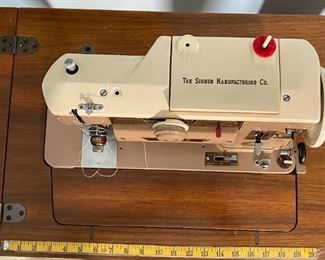 Singer 401A Sewing Machine in Console Cabinet	31 x 29 x 16.5in	HxWxD
