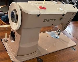 Singer 401A Sewing Machine in Console Cabinet	31 x 29 x 16.5in	HxWxD
