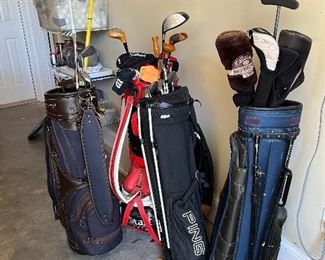 Coach Johnson several golf clubs and bags