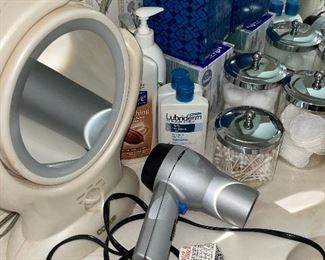 Bathroom Vanity Items: Makeup Mirror, Blow Dryer, Lotions