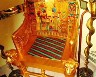 Pharoah's Excellence: Gilded high quality, hand crafted exact reproduction of King Tut's as was recovered from his burial tomb and now sits in a Museum in Egypt. These cost about $2500.- new but this one is more affordable and you may never have another opportunity to own one from an estate sale.