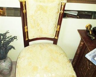 A set of six hand carved mahogany Neoclassical Egyptian Chairs. 