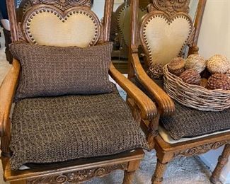 Antique heavily carved oak chairs, reupholstered with woven leather cushions.  Purchased from an East Coast estate.