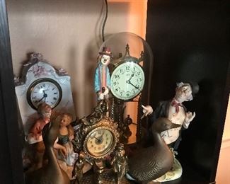 Different clocks and figurines 