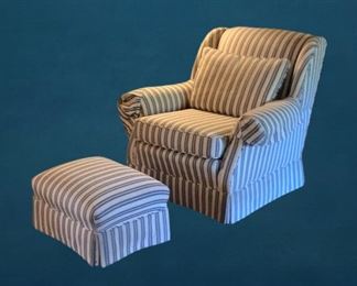 A good looking vintage armchair and ottoman upholstered in blue and white ticking fabric (located in the garage due to limited space in home) go in the garage and say "hello."