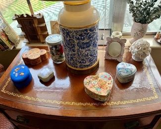 Leather-topped bow-front chest with boxed 