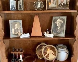 Ethan Allen furniture stocked with the family smoking pipes, photos of yore and a metronome. No piano at this house but plenty of sheet music and songbooks for piano and choral. 