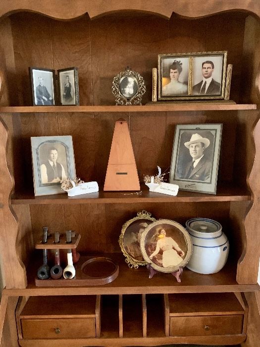 Ethan Allen furniture stocked with the family smoking pipes, photos of yore and a metronome. No piano at this house but plenty of sheet music and songbooks for piano and choral. 