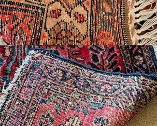 Reverse view of the two Persian rugs
