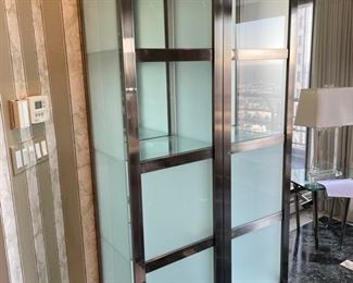Pair of modern glass and metal cabinets with privacy glass. Interior lighting. Each measures 21" W x 78" H. Photo 1 of 2.