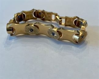 14K gold bracelet with sapphires.