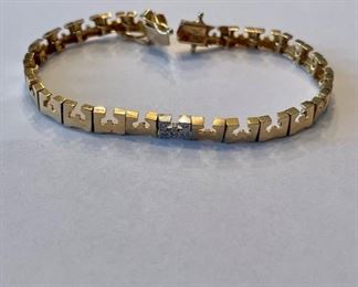 14K gold "E" monogrammed bracelet.