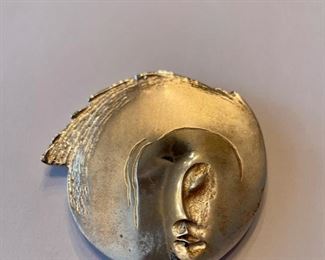 Sterling silver pin.