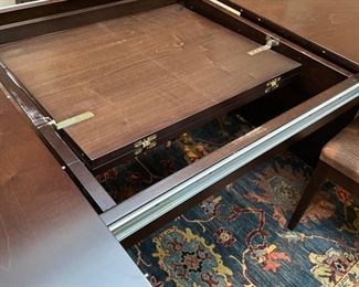 Hugues Chevalier "Tamara" dining room table with self-storing leaf. Table measures 98" to 126" L x 48" W x 31" H. 28" clearance. Photo 2 of 3.