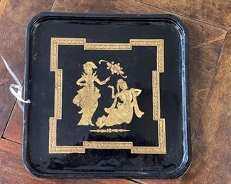 Black lacquer tray with gilt detailing.