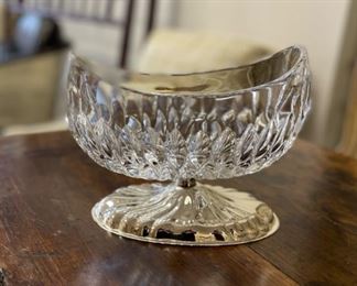 Footed crystal bowl with silver base.