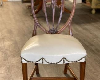 Set of 8 Chippendale style dining chairs upholstered in white leather with nail head trim. Measures 20” Seat H: 19.” Photo 1 of 3.