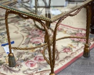 Pair of Italian Hollywood Regency-Style gilt nesting tables with tassel feet.