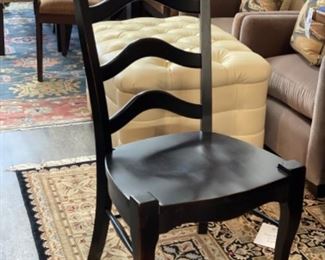 Set of 8 Ebony ladder back chairs.