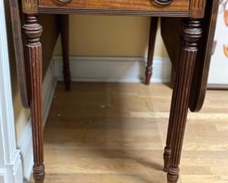 Gate leg, drop-leaf table. Measures 24" W. Has two 18" drop leaves. 42" W x 30" H with a 25" clearance. Photo 1 of 2.