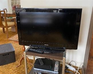 Insignia TV, vintage stand, Sony VHS player