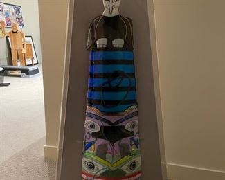 "Totem Eagle Pole" style number 115 by Shawn Athari. This pole represents the Eagle, Raven, Beaver and Frog. The original is on displace at the Provincial Museum in Victoria, B. C. Measures 43"H x 22" W x 6" D.