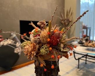 Faux flower arrangement in Buddha Faces vase. Photo 1 of 3.