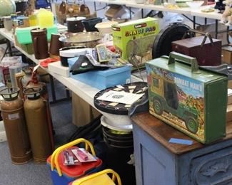 Primitives, vintage fire equipment including an old helmet and fire hose