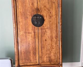 Golden Triangle Ming Style Round Post Cabinet with two drawers. Elmwood. Taiyuan, China. Circa 1820. Measures 38" W x 22" D x 74.5" H. Measures Photo 1 of 2.
