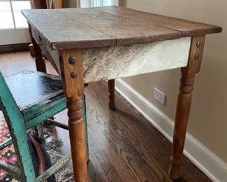Desk with hair-on-hide paneled apron. Measures 35.5" W x 23.25" D x 28.5". Photo 1 of 6.