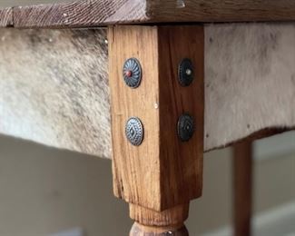 Desk with hair-on-hide paneled apron. Measures 35.5" W x 23.25" D x 28.5". Photo 4 of 6.