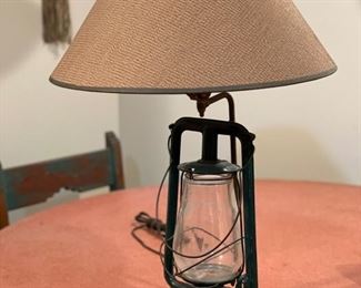 Antique lantern fashioned into a lamp. Photo 1 of 4.