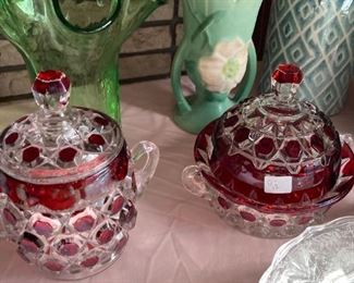 . . . two nice pieces of cranberry glass -- notice art glass, pottery vase, and Weller vase in background