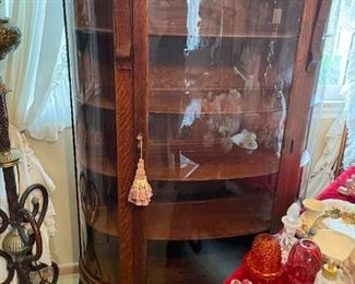 . . . a beautiful early 1900's curved-glass cabinet