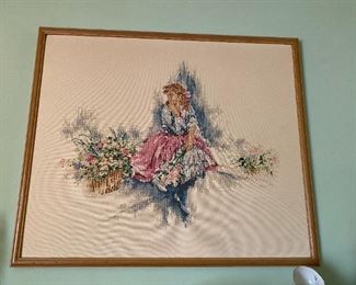 Framed needlework.
