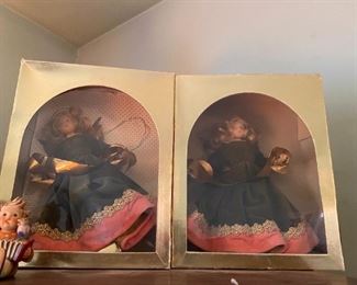 Dolls in boxes.