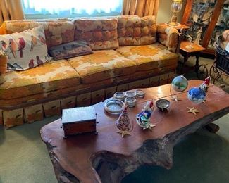 Floral sofa and redwood coffee table.
