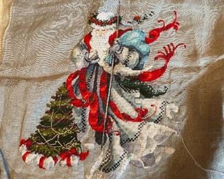 Unframed needlework.